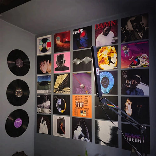 Modern bedroom decorated with album cover posters arranged in a stylish music wall collage, perfect for music lovers, dorm rooms, studios, and home decor.