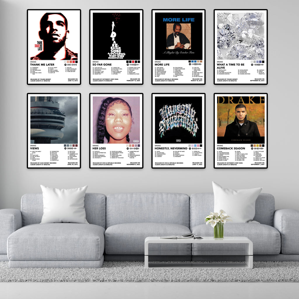 Modern living room featuring eight framed Drake album cover posters including Thank Me Later, So Far Gone, More Life, What a Time to Be Alive, Views, Her Loss, Honestly Nevermind, and Comeback Season. Premium 8x12 inch music wall art for home decor, bedrooms, gaming rooms, and studios.