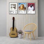 Heavy Hitters album cover posters displayed as music room wall decor featuring Taylor Swift, Travis Scott and Kendrick Lamar artwork in a modern interior with guitar and chair.