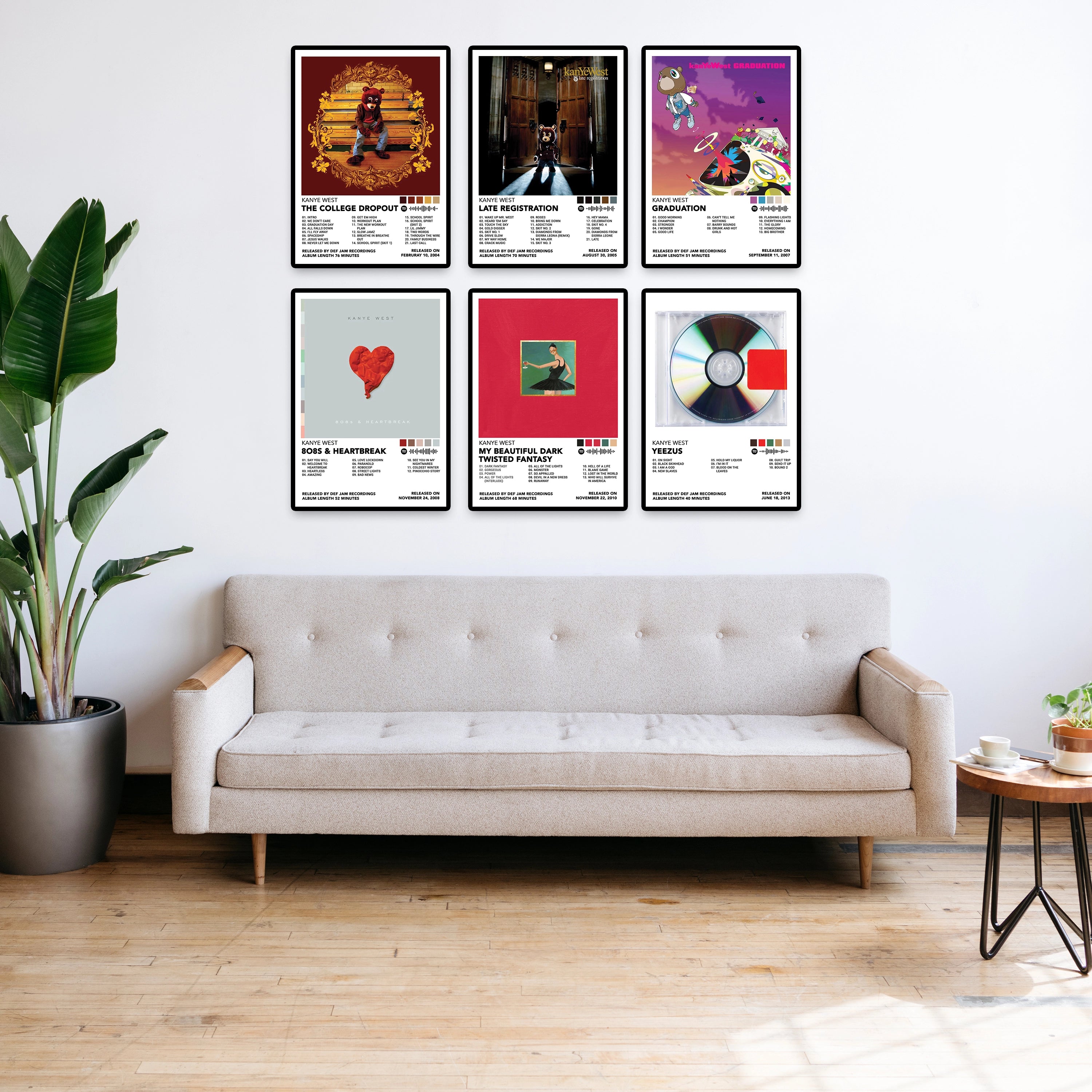 Modern living room featuring six Kanye West album posters displayed above a beige sofa. Premium 8x12 inch unframed music posters showcasing The College Dropout, Late Registration, Graduation, 808s & Heartbreak, My Beautiful Dark Twisted Fantasy, and Yeezus.