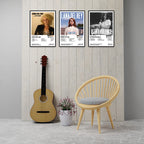 Three Lana Del Rey 8x12 album cover posters displayed on a modern wall above an acoustic guitar and wooden chair, featuring Lana Del Rey, Born to Die, and Ultraviolence. Premium glossy cardstock music wall art for bedroom, living room, studio, or dorm decor.