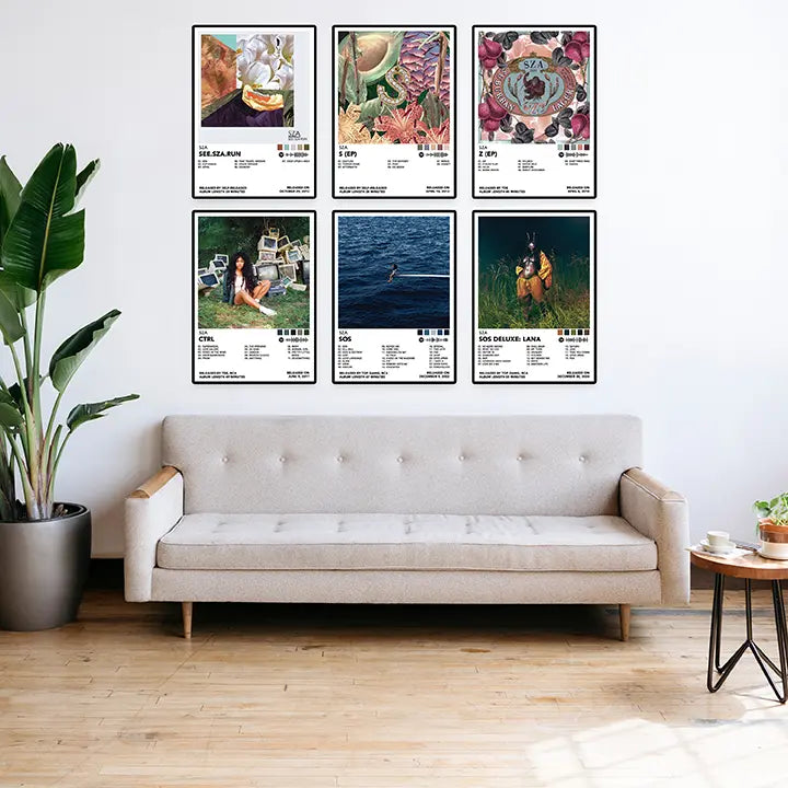 Six SZA posters arranged in two rows above a living room sofa.