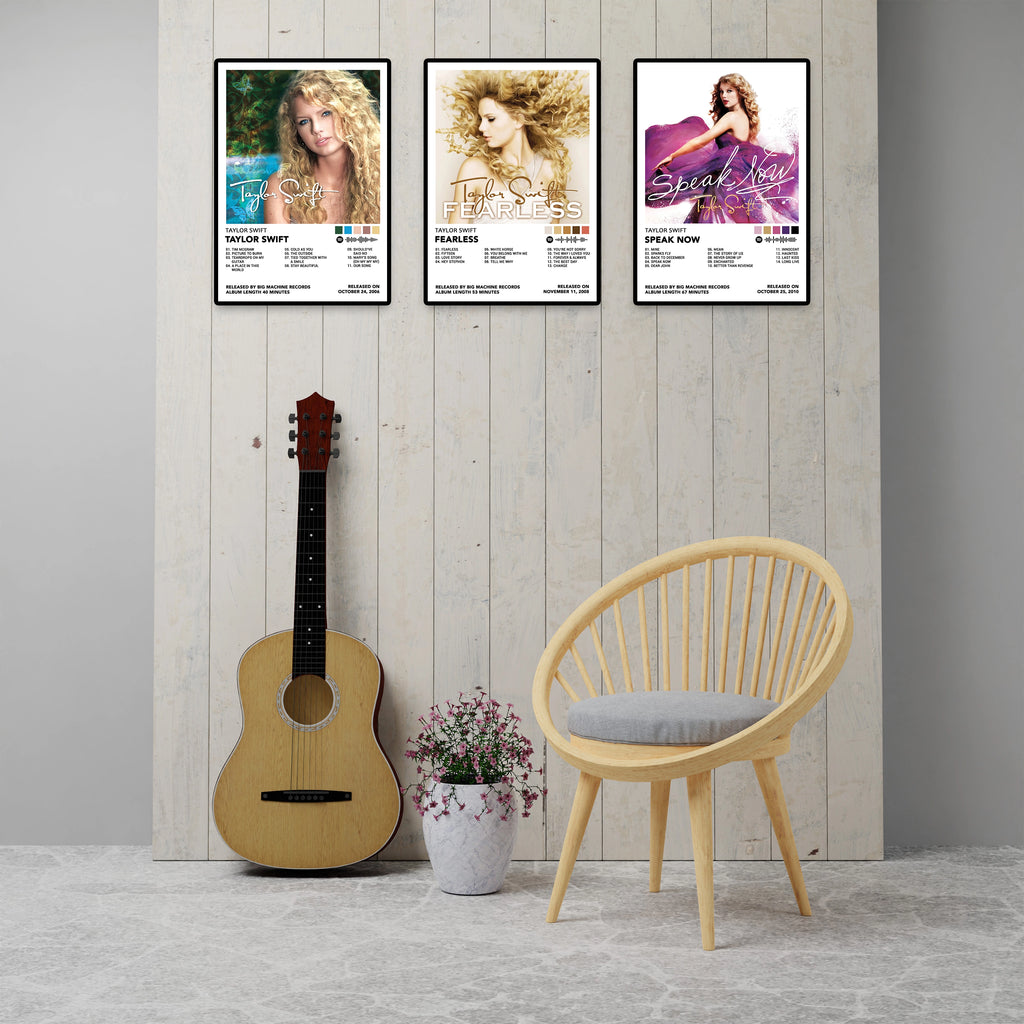 Six Taylor Swift album cover posters displayed above a modern sofa in a minimalist living room. Features Red, 1989, Reputation, Lover, Folklore, and Evermore album posters printed on premium 260 GSM glossy cardstock. Perfect Swiftie wall decor, bedroom decor, dorm room decoration, music room art, and Taylor Swift fan gifts.