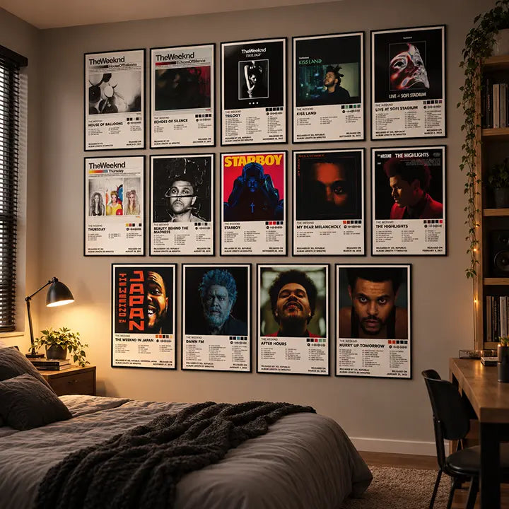 The Weeknd’s 14 album cover posters arranged in a grid on a bedroom wall.